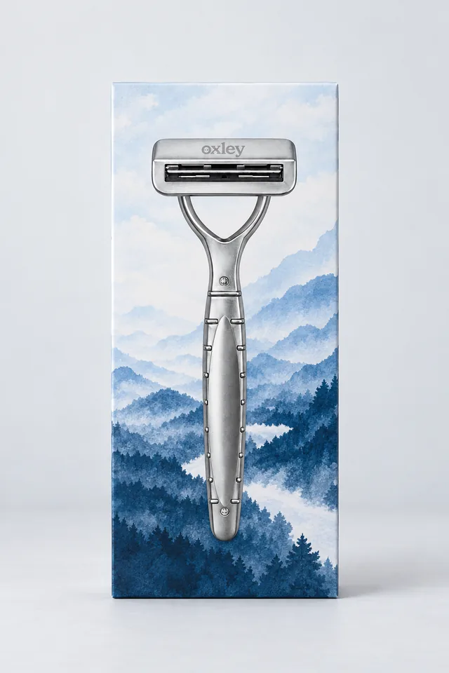 Silver Oxley razor on packaging with blue mountain artwork