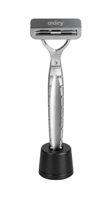 Oxley razor standing upright in its black stand